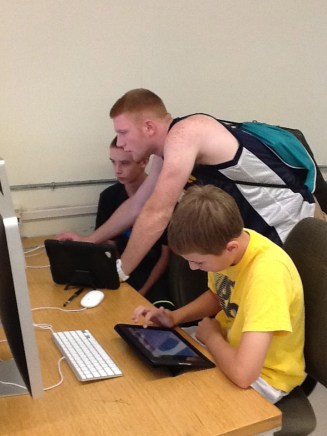 Adam helping his classmates organize their Google Drive